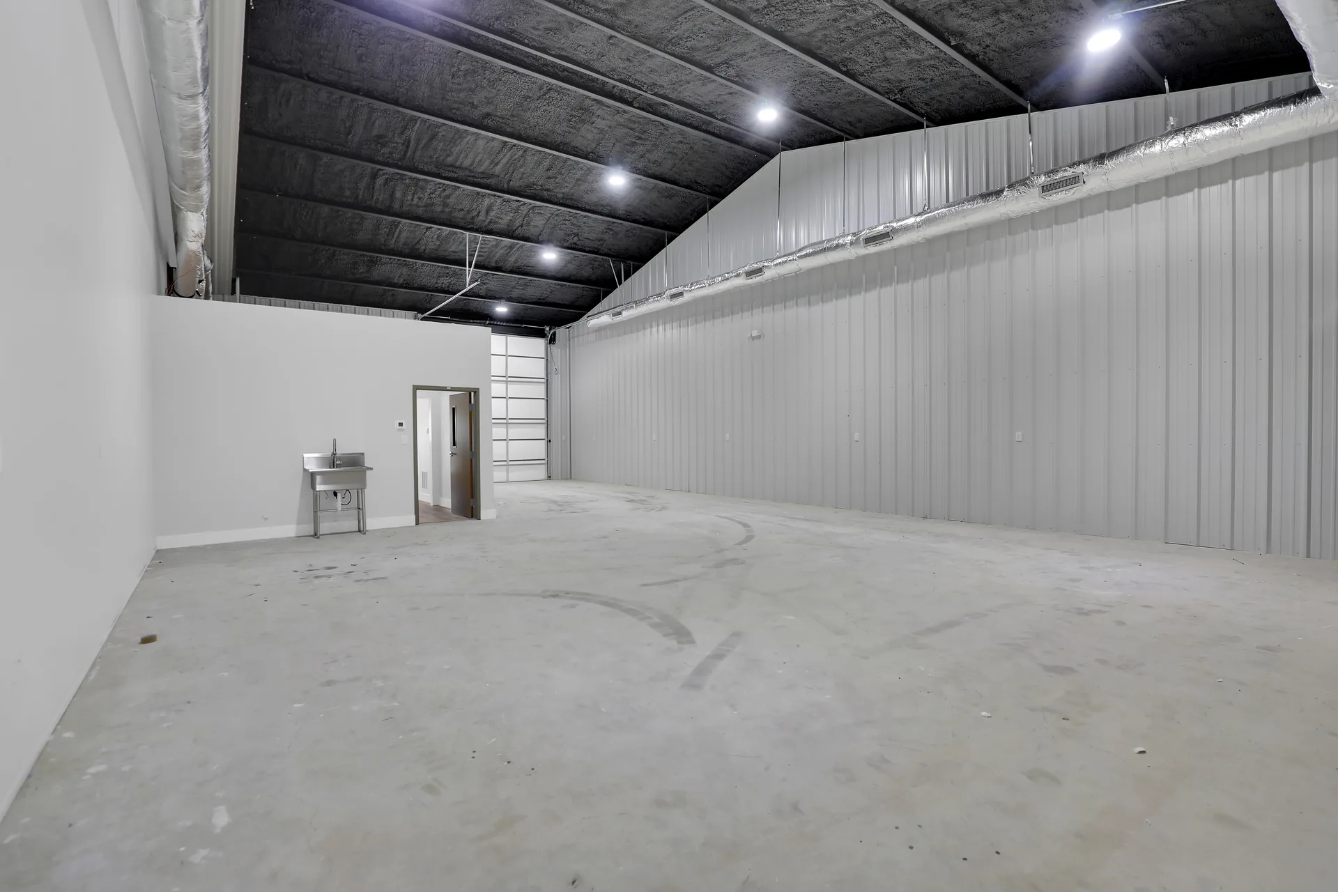 Warehouse bay with adjacent finished office and restroom build-out at Triple C Business Park